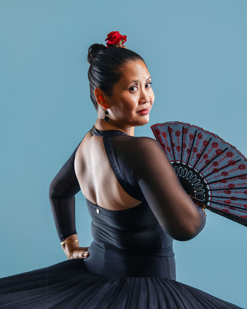 Dancer in vibrant red flowing skirt