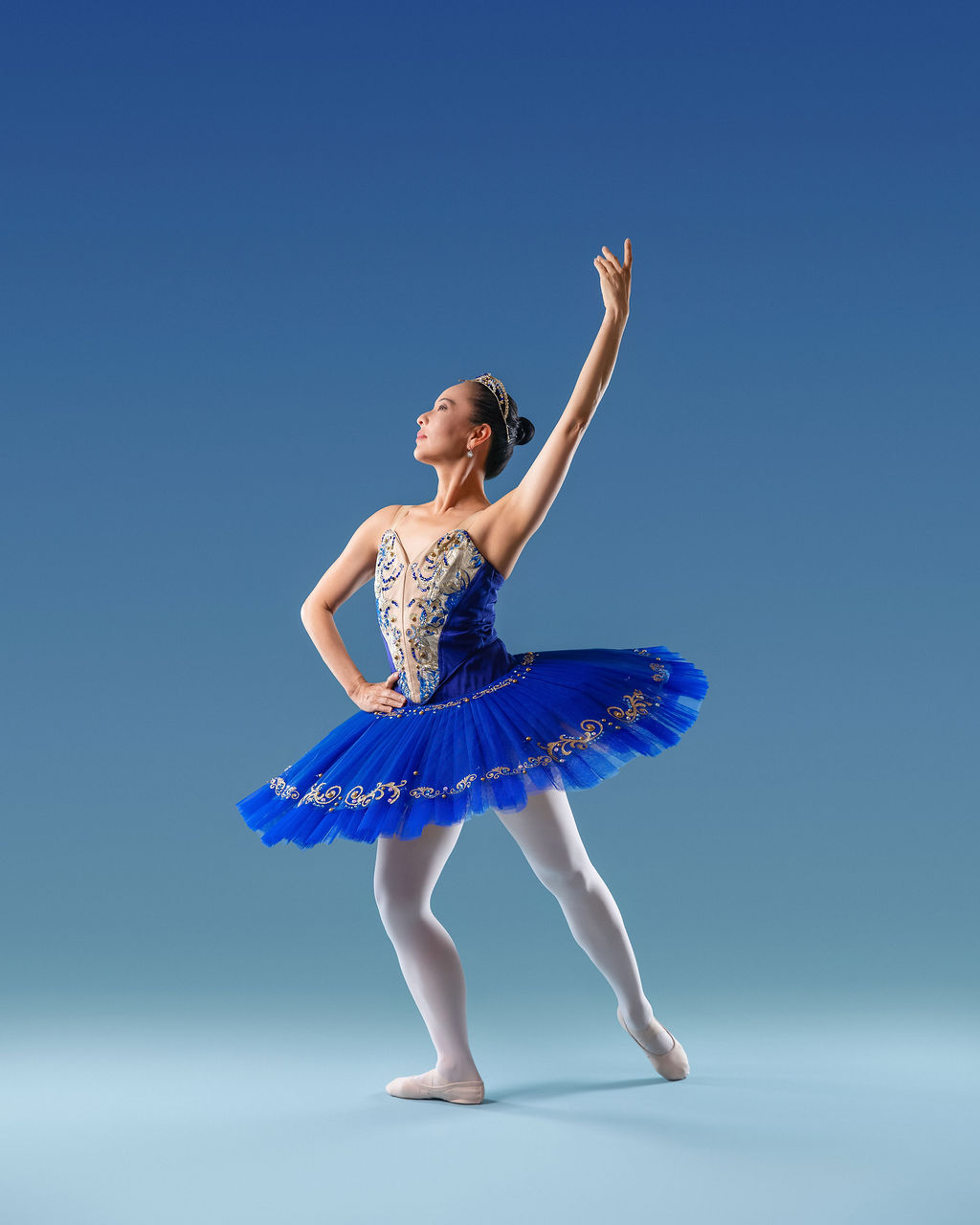 Dancer in a blue tutu, graceful pose