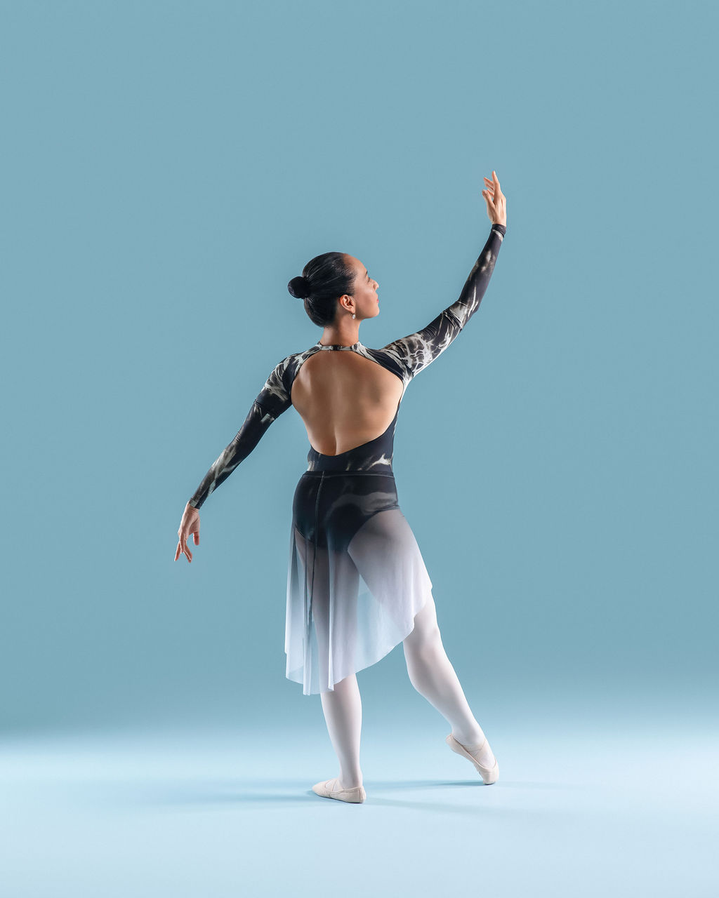 Dancer in a contemporary costume, back to camera