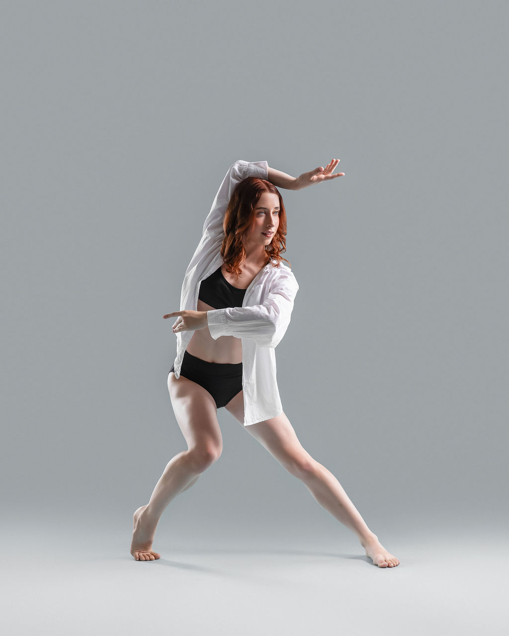 Dancer in a contemporary pose wearing white